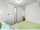 A partial view of a bedroom highlighting an open door and white trim at 6001- 1776 S Kings Highway, Myrtle Beach, SC 29575