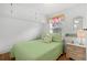 Cozy bedroom features a bed, a window with vibrant curtains and a nightstand at 6001- 1776 S Kings Highway, Myrtle Beach, SC 29575