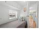 This bedroom includes a twin bed, a window, and glimpses into the kitchen at 6001- 1776 S Kings Highway, Myrtle Beach, SC 29575