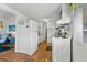 Cozy kitchen with white appliances and cabinets, seamlessly connecting to a comfortable living area at 6001- 1776 S Kings Highway, Myrtle Beach, SC 29575