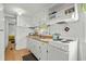 Bright kitchen features white cabinets, light wood counters, and modern appliances with a view to the sink at 6001- 1776 S Kings Highway, Myrtle Beach, SC 29575