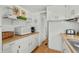 Functional kitchen boasts white cabinets and wood counters with modern appliances and ample storage at 6001- 1776 S Kings Highway, Myrtle Beach, SC 29575