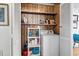 Laundry room with washer, shelving, and storage within white-paneled doors at 6001- 1776 S Kings Highway, Myrtle Beach, SC 29575