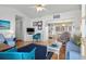 Cozy living room with bright decor, seamlessly connected to the dining area at 6001- 1776 S Kings Highway, Myrtle Beach, SC 29575