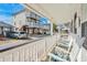 Spacious porch with rocking chairs, perfect for enjoying the neighborhood views at 6001- 1776 S Kings Highway, Myrtle Beach, SC 29575