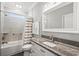 Bathroom with granite countertop vanity, bathtub, shower combo and a large mirror at 6001- 5432 S Kings Highway, Myrtle Beach, SC 29575