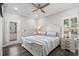 Cozy bedroom featuring a decorative bed frame, stylish furnishings, and a ceiling fan at 6001- 5432 S Kings Highway, Myrtle Beach, SC 29575