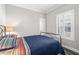 Bedroom featuring a metal bed frame and shuttered windows at 6001- 5432 S Kings Highway, Myrtle Beach, SC 29575