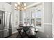Charming dining area with a modern table set, complemented by natural light streaming through shuttered windows at 6001- 5432 S Kings Highway, Myrtle Beach, SC 29575