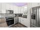 Modern kitchen featuring stainless steel appliances, white cabinets, and granite countertops for a contemporary look at 6001- 5432 S Kings Highway, Myrtle Beach, SC 29575
