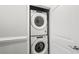 Modern laundry room with stacked washer and dryer units in a closet at 6001- 5432 S Kings Highway, Myrtle Beach, SC 29575