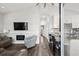 Open-concept living area featuring hardwood floors, a built-in fireplace, and granite countertops at 6001- 5432 S Kings Highway, Myrtle Beach, SC 29575