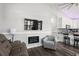 Cozy living room featuring a fireplace, TV, comfortable seating, and an open-concept design to the kitchen at 6001- 5432 S Kings Highway, Myrtle Beach, SC 29575