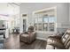 Bright living room showcasing large windows, comfortable seating, and hardwood floors offering peaceful views at 6001- 5432 S Kings Highway, Myrtle Beach, SC 29575