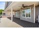 Outdoor porch area with durable flooring, ceiling fans, lighting and backyard access at 6001- 5432 S Kings Highway, Myrtle Beach, SC 29575