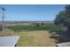 View from the backyard featuring a large grassy lawn and expansive marshland in the distance, providing a serene backdrop at 640 Willowbank Rd., Georgetown, SC 29440