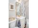 Cozy bathroom features a shower with patterned curtain, vanity, and gold accents at 640 Willowbank Rd., Georgetown, SC 29440