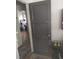 Hallway storage featuring a tall cabinet with decorative door handle and a partial view into another room at 640 Willowbank Rd., Georgetown, SC 29440