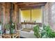 Relaxing sunroom with plants and a comfortable white couch at 640 Willowbank Rd., Georgetown, SC 29440
