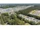 Scenic aerial view showcasing residential homes, lush trees, and serene lakes within the community at 6465 Royal Pine Dr., Myrtle Beach, SC 29588