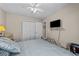 Cozy bedroom with a comfortable bed, closet, and a wall-mounted television at 6465 Royal Pine Dr., Myrtle Beach, SC 29588