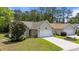 Well-kept home featuring a tidy front yard and a convenient two-car attached garage at 6465 Royal Pine Dr., Myrtle Beach, SC 29588