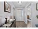 Welcoming gray hallway showcasing wood flooring and entryway into the main bedroom at 6465 Royal Pine Dr., Myrtle Beach, SC 29588