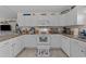 Bright kitchen featuring white cabinetry, granite countertops, and modern appliances at 6465 Royal Pine Dr., Myrtle Beach, SC 29588