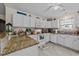 Bright kitchen featuring white cabinetry, granite countertops, and modern appliances at 6465 Royal Pine Dr., Myrtle Beach, SC 29588