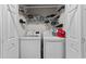 Bright laundry room features a washer, dryer, and plenty of storage space at 6465 Royal Pine Dr., Myrtle Beach, SC 29588