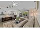 Bright, open living room featuring slider doors to the patio and an adjoined kitchen at 6465 Royal Pine Dr., Myrtle Beach, SC 29588