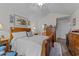 Comfortable main bedroom with wooden furniture, a large window, and a cozy rug at 6465 Royal Pine Dr., Myrtle Beach, SC 29588