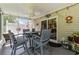 Relaxing screened patio with comfortable seating and a ceiling fan for enjoying outdoor living at 6465 Royal Pine Dr., Myrtle Beach, SC 29588
