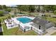 Aerial view of community pool with hot tub, lounge chairs, and well-maintained landscaping at 6465 Royal Pine Dr., Myrtle Beach, SC 29588