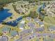 Aerial view of condos surrounded by lush landscaping, ponds, golf courses, and parking at 673 Tupelo Ln. # G, Longs, SC 29568