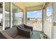 Enjoy the outdoors from this screened balcony with comfortable seating and neighborhood views at 673 Tupelo Ln. # G, Longs, SC 29568