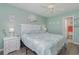 Relaxing bedroom featuring beach-inspired decor, a comfortable bed, and soft, natural lighting at 673 Tupelo Ln. # G, Longs, SC 29568