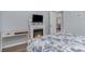 Cozy bedroom with a fireplace and beach-themed comforter at 673 Tupelo Ln. # G, Longs, SC 29568