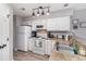 Efficient kitchen featuring white cabinetry, appliances, laminate countertops, and stainless steel sink at 673 Tupelo Ln. # G, Longs, SC 29568