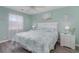 The main bedroom features coastal decor, a queen-size bed, and natural light at 673 Tupelo Ln. # G, Longs, SC 29568