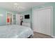 This main bedroom features coastal decor, a queen bed, and closet space at 673 Tupelo Ln. # G, Longs, SC 29568