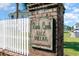 Buck Creek Golf Villas signage at the entrance to a private community at 673 Tupelo Ln. # G, Longs, SC 29568