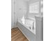 Bathroom showcases a large soaking tub and hardwood floors at 680 Twinflower St., Little River, SC 29566