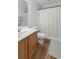 Cozy bathroom featuring a single sink vanity, toilet, and shower with a curtain at 680 Twinflower St., Little River, SC 29566