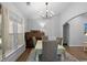 Dining room area featuring hardwood floors, natural light, and neutral paint at 680 Twinflower St., Little River, SC 29566