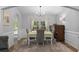 Dining room features hardwood floors, neutral paint, chandelier, and windows at 680 Twinflower St., Little River, SC 29566