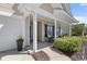 Inviting front porch with seating area and neat landscaping near an attached garage at 680 Twinflower St., Little River, SC 29566