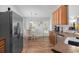 Charming kitchen with stainless steel appliances and view of the eat-in area at 680 Twinflower St., Little River, SC 29566