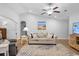 Inviting living room with a ceiling fan, contemporary furnishings and neutral tones at 680 Twinflower St., Little River, SC 29566