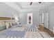 A view of primary bedroom with neutral colors and a walk-in closet at 680 Twinflower St., Little River, SC 29566